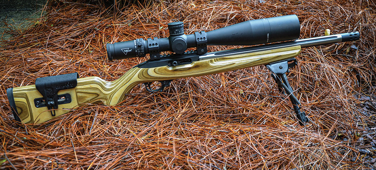 As explained by Layne in the text, the heavy all-steel barrel of the earlier 10/22 Competition rifle built in the Ruger Custom Shop required stiffening the aluminum receiver by giving it an integral optic rail. Additional front and rear receiver fasteners were also required.